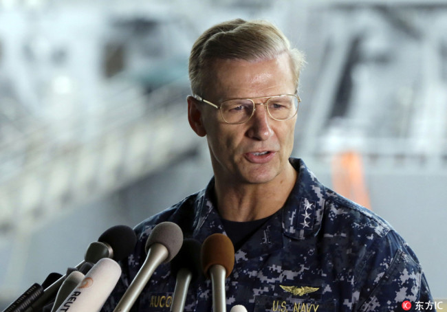 In this June 18, 2017, file ., U.S. Navy Vice Adm. Joseph Aucoin, Commander of the U.S. 7th Fleet, speaks during a press conference, with damaged USS Fitzgerald as background at the U.S. Naval base in Yokosuka, southwest of Tokyo.[File Photo: IC]