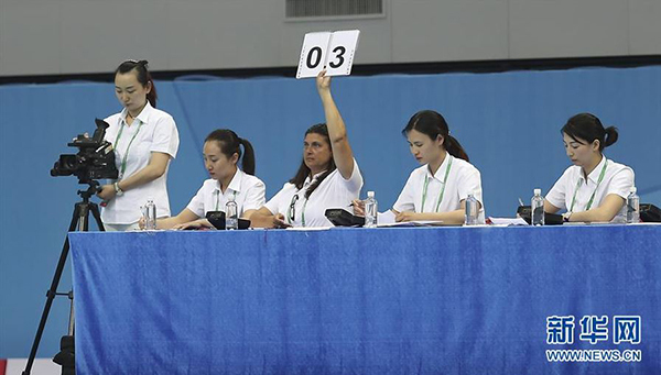 Foreign referees in Synchronized Swimming in the 13th National Games of China [Photo: Xinhua]