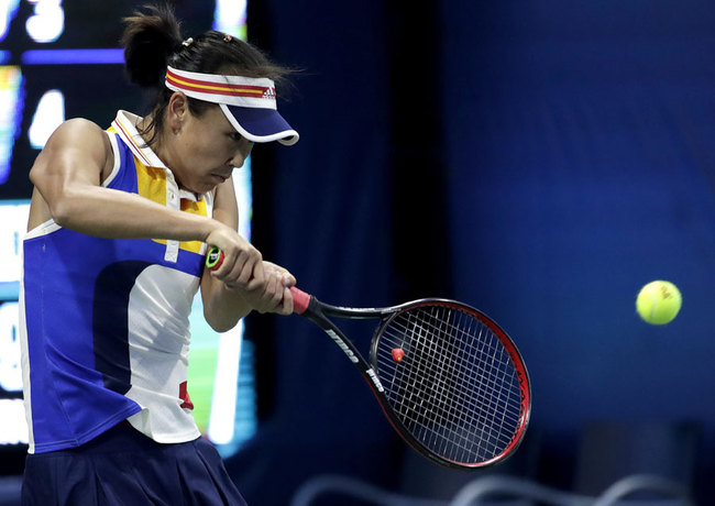 Peng Shuai, of China, returns a shot to Amandine Hesse, of France, during the first round of the U.S. Open tennis tournament, Monday, Aug. 28, 2017, in New York. [Photo: AP /Julio Cortez]