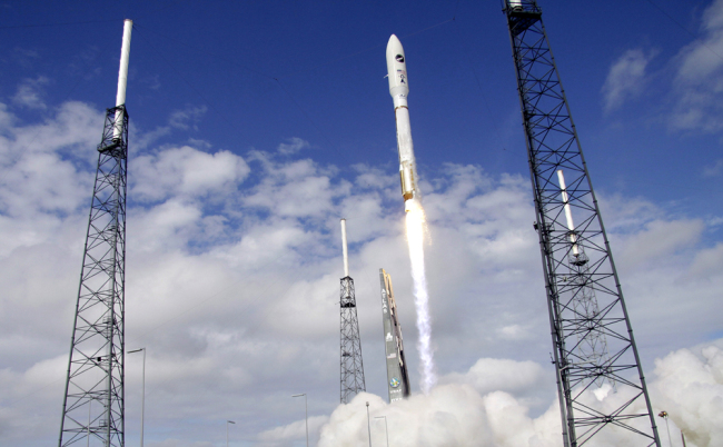 A United Launch Alliance Atlas V rocket, carrying an X-37B experimental robotic space plane, lifts off from launch complex 41 at the Cape Canaveral Air Force Station, Dec. 11, 2012, in Cape Canaveral, Fla. [Photo: AP/John Raoux]