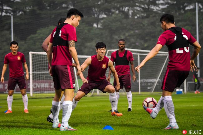 Players of Guangzhou Evergrande prepare for their match against Changchun Yatai in Guangzhou, capital of Guangdong Province, September 7, 2017. [Photo: IC]  