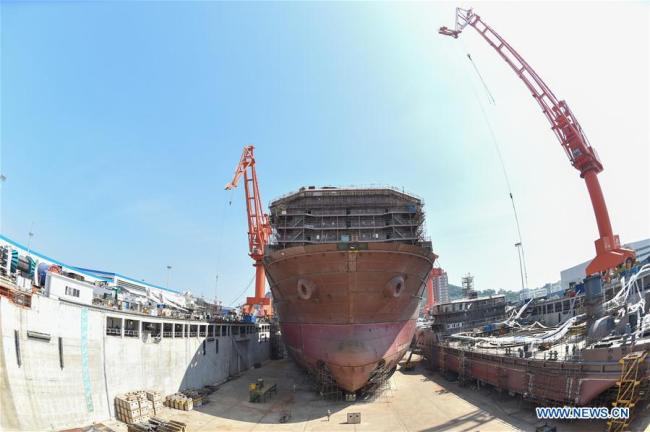 Photo taken on Sept. 20, 2017 shows the construction site of world's first deep ocean mining vessel in southeast China's Fujian Province. The 227-meter-long vessel, upon completion, will be capable of working at depths of 2.5 kilometers and carrying 40,000 tons of ore. The construction of the hull of the vessel has been completed, according to its builder Fujian Mawei Shipbuilding Ltd. [Photo: Xinhua]