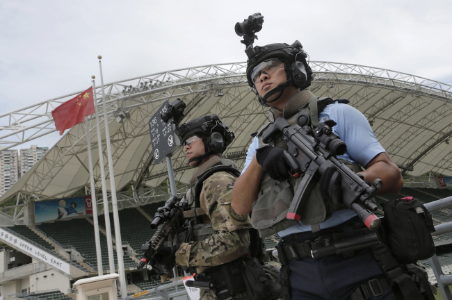Police units take part in an anti-terror drill in Hong Kong, Friday, Aug. 25, 2017. Officers, some of them posing as assailants, held a simulated a terror attack at a concert as part of preparations for a performance in Hong Kong on Sep. 21 by singer Ariana Grande. [Photo: AP Photo/Vincent Yu]