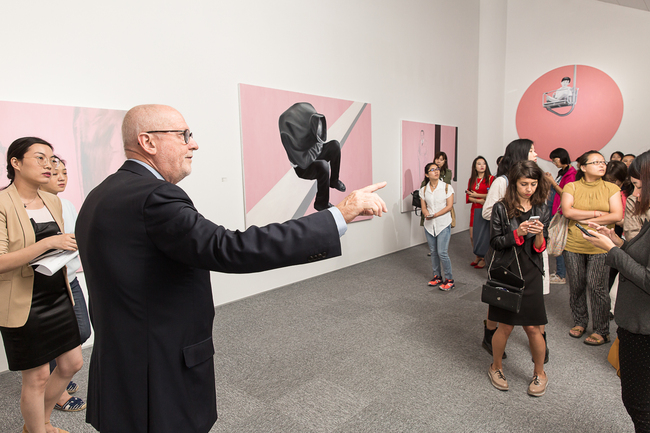 Lorand Hegyi, curator of the Bridging Asia–Europe exhibition series, outlines the event to visitors in advance of its launch on September 26, 2017 in Beijing.[Photo: China Plus]