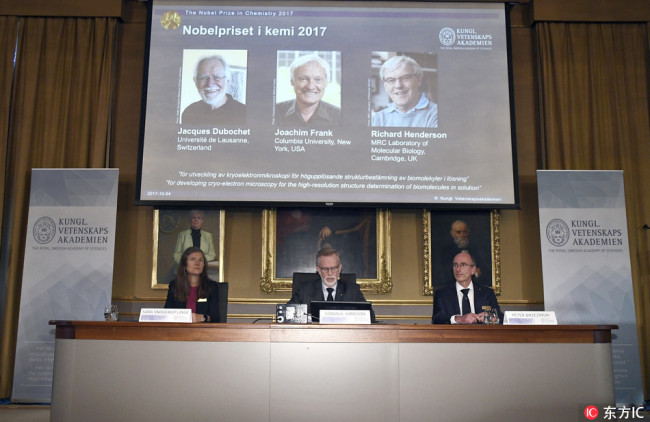 From left, Sara Snogerup Linse, chairman of the Nobel Committee in Chemistry, Goran K. Hansson, secretary of the Royal Academy of Sciences, and Peter Brzezinski, member of the Nobel Committee, sit during a press conference as they announce - Jacques Dubochet - from the University of Lausanne, Switzerland, Joachim Frank from Columbia University, USA and Richard Henderson, from the MRC Laboratory of Molecular Biology, Cambridge, in England as the winners of the 2017 Nobel Prize in Chemistry, at the Royal Academy of Sciences in Stockholm, Wednesday, Oct. 4, 2017.[Photo: IC]