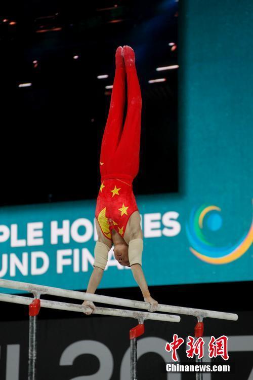 Chinese gymnast Xiao Ruoteng competes in parallel bars competition in men's all-around at the Artistic Gymnastics World Championships in Montreal, Canada on Thursday, October 5, 2017. [Photo: Chinanews.com]