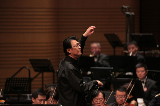 Tan Lihua conducting the Beijing Symphony Orchestra, which is the third orchestra performing at Orchestral Marathon on Saturday, October 14, 2017 at Poly Theatre in Beijing. [Photo: China Plus]