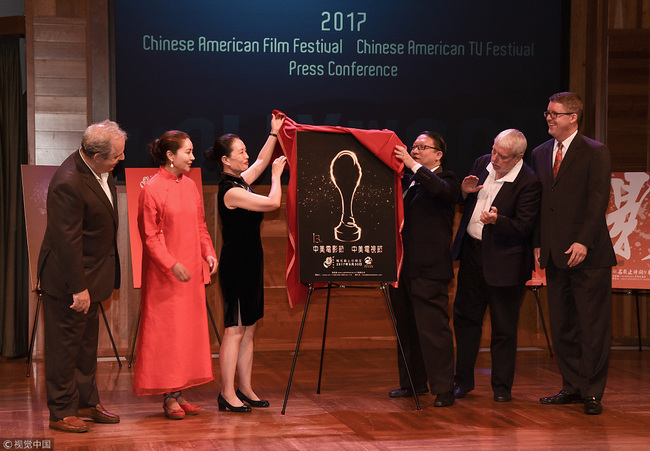 Bill Mechanic, Christine Antonovich, Wang Jin, James Su, Andre Morgan and John F. Szabo officially unveil the 2017, 13th Annual Chinese American Film Festival and Television Festival poster at Los Angeles Public Library on September 1, 2017 in Los Angeles, California. [File Photo: VCG/Tara Ziemba/Getty Images]