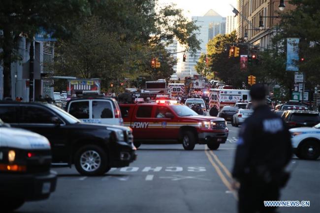 Police vehicles and ambulances are seen near the site of an attack in lower Manhattan in New York, the United States, on Oct. 31, 2017. Eight people were killed and a dozen more injured after a truck plowed into pedestrians near the World Trade Center in New York City, the mayor said on Tuesday.[Photo: Xinhua]