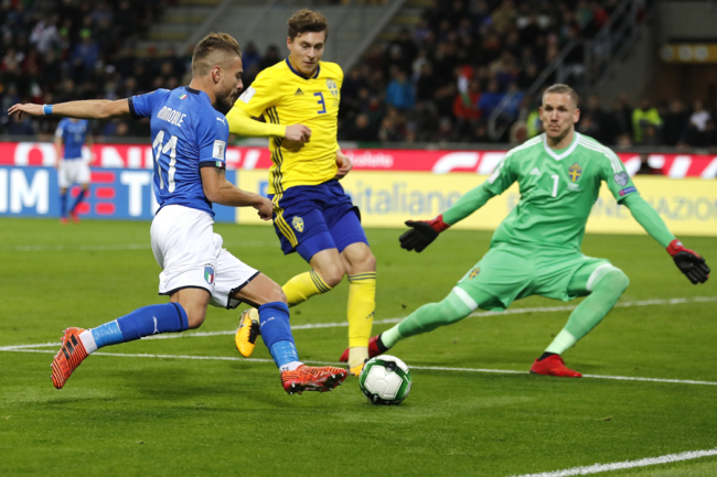 Italy's Ciro Immobile, left, shots on goal during the World Cup qualifying play-off second leg soccer match between Italy and Sweden, at the Milan San Siro stadium, Italy, Monday, Nov. 13, 2017. [Photo: AP]