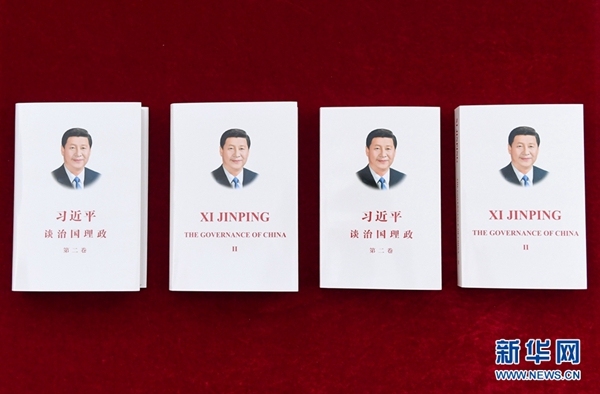 The Chinese and English editions of the second volume of "Xi Jinping: The Governance of China". The book is going to be published in 16 countries. [Photo: Xinhua]
