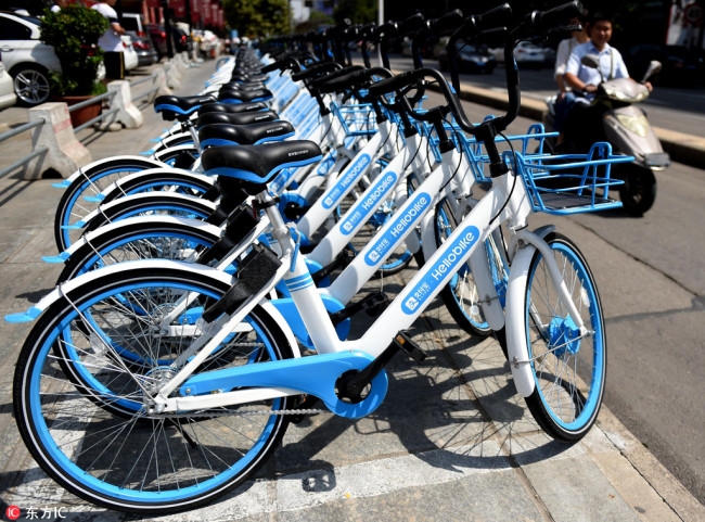 Bicycles of Chinese bike-sharing service Hellobike are lined up on a street in Luoyang city, central China's Henan province, 11 September 2017.[Photo: IC]