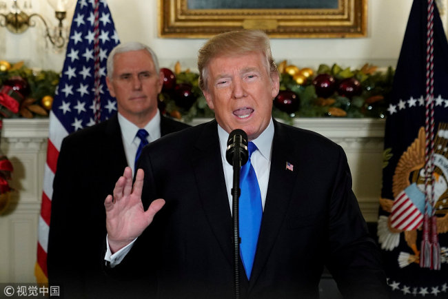 U.S. President Donald Trump, flanked by ‪Vice President Mike Pence‬, delivers remarks recognizing Jerusalem as the capital of Israel at the White House in Washington, U.S. December 6, 2017. [Photo: VCG]