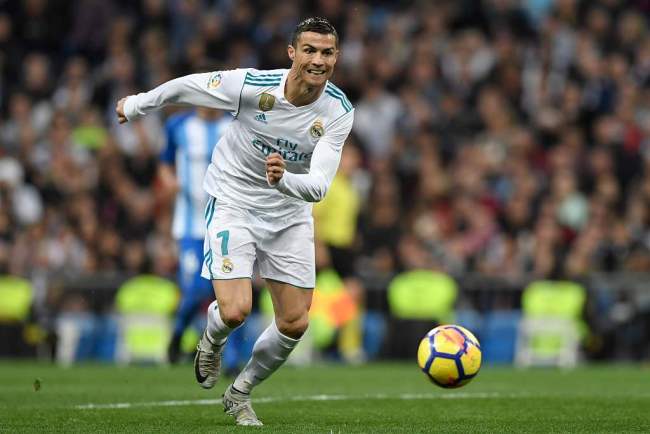 Real Madrid's Portuguese forward Cristiano Ronaldo running for the ball during the Spanish league football match Real Madrid CF against Malaga CF on 25, November 2017 at the Santiago Bernabeu stadium in Madrid. [File photo: VCG]