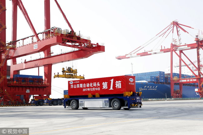 Phase IV of Shanghai Yangshan Deep Water Port, the world's biggest automated container terminal, starts trial operations on December 10, 2017. [Photo: VCG]
