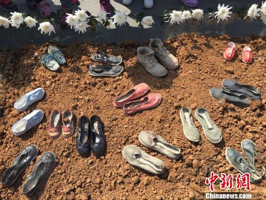80 pairs of ceramic shoes representing victims of the Nanjing Massacre are on display at the Nanjing Massacre Memorial Hall, Jiangsu province, on April 3, 2017. [Photo: Chinanews.com]
