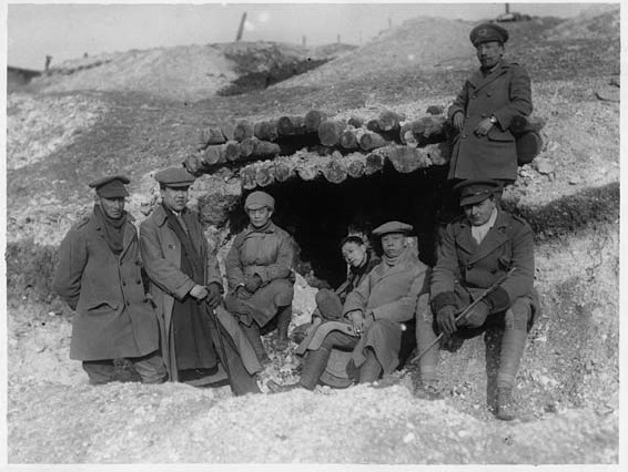 Five Chinese students, probably from the newly established Republic of China posing with two British officers at a dugout on the Western Front [Photo: National Library of Scotland]