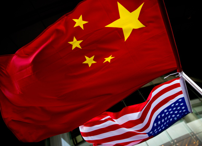 File photo of Chinese and U.S. national flags. [Photo: AP]