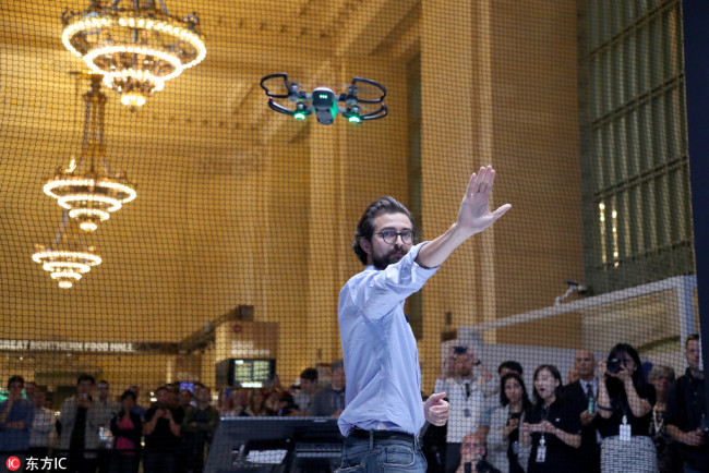 Michael Perry, director of Strategic Partnerships of DJI, demonstrates the new DJI Spark drone in Vanderbilt hall at Grand Central Station in New York, US, May 24, 2017. [File photo: IC]