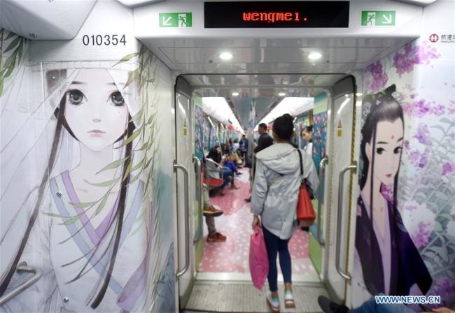 Animation drawings are seen in a metro train in Hangzhou, Zhejiang Province, April 27, 2017. [File photo: Xinhua/Wang Dingchang]