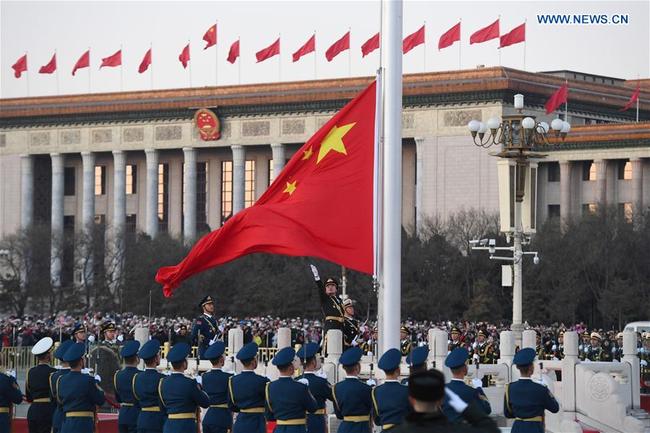 The Guard of Honor of the Chinese People's Liberation Army(PLA) perform the national flag-raising duty at the Tian'anmen Square in Beijing, capital of China, Jan. 1, 2018. The responsibility for guarding China's national flag and firing salute cannons at the Tian'anmen Square was transferred to the Chinese People's Liberation Army from Jan. 1, 2018, as authorized by the Central Committee of the Communist Party of China. Before Jan. 1, the ceremony was conducted by the armed police. [Photo: Xinhua/Shen Hong]