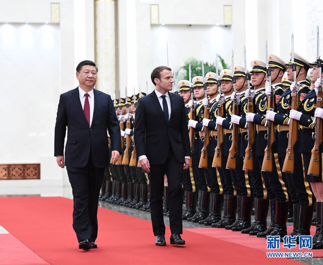 Chinese President Xi Jinping (L) holds a welcoming ceremony for visiting French President Emmanuel Macron before their talks in Beijing, capital of China, Jan. 9, 2018. [Photo: Xinhua/Li Xueren]