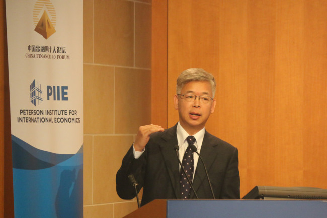 Huang Yiping, deputy dean at National School of Development at Peking University spoke at “The New Era of Chinese Economy and China’s Financial Opening-up”, a forum co-organized by Peterson Institute of International Economics and China Finance 40 Forum in Washington D.C. on January 11, 2018. [Photo: China Plus]