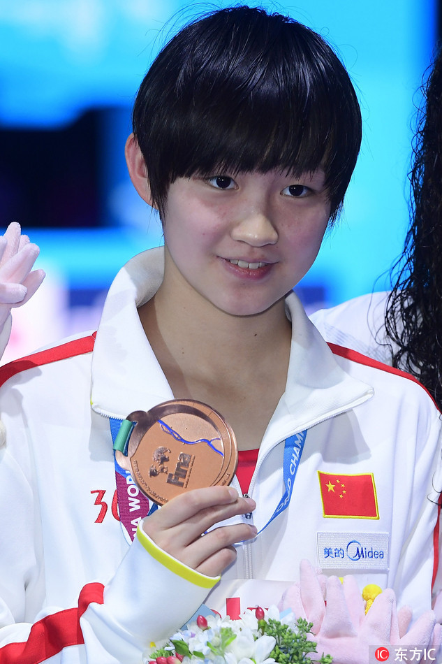 Li Bingjie with her bronze medal on the podium for the Women's 400m Freestyle at the World Championships in Budapest, Hungary on July 23, 2017. [File Photo: ]