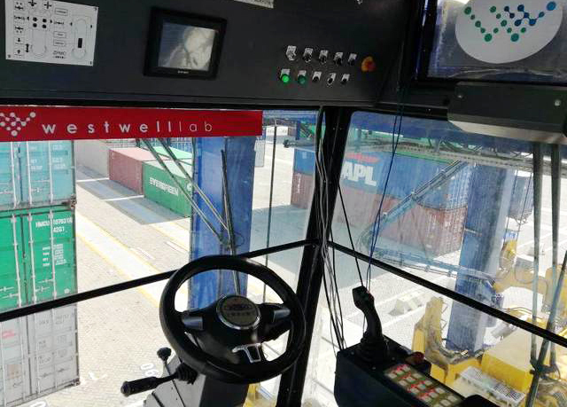 Photo of the internal view of a Chinese-produced self-driving container straddle carrier at a port in Shanghai, January 14, 2018. [Photo: jfdaily.com]