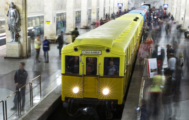 People come to look at Soviet-era vintage subway cars parked in the Partizanskaya metro station in Moscow on May 15, 2015. [Photo: AP/Pavel Golovkin]