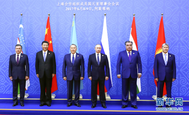 Chinese President Xi Jinping (2nd from left) takes a group photo with leaders from other SCO member states at the summit in Astana, Kazakhstan on June 9, 2018. [File Photo: Xinhua/Ding Lin]
