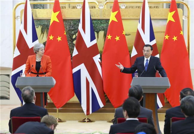 Chinese Premier Li Keqiang and visiting British Prime Minister Theresa May meet the press after a China-Britain annual dialogue between heads of government in Beijing on Jan. 31, 2018. [Photo: Xinhua/Ding Haitao]