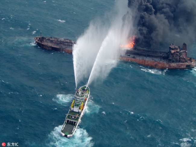 A handout made available by the 10th Regional Coast Guard Headquarters on 15 January 2018 shows the fire on the Panama-registered tanker 'Sanchi' being doused after a collision with Hong Kong-registered freighter 'CF Crystal,' off China's eastern coast, January 10, 2018. [File Photo: IC]