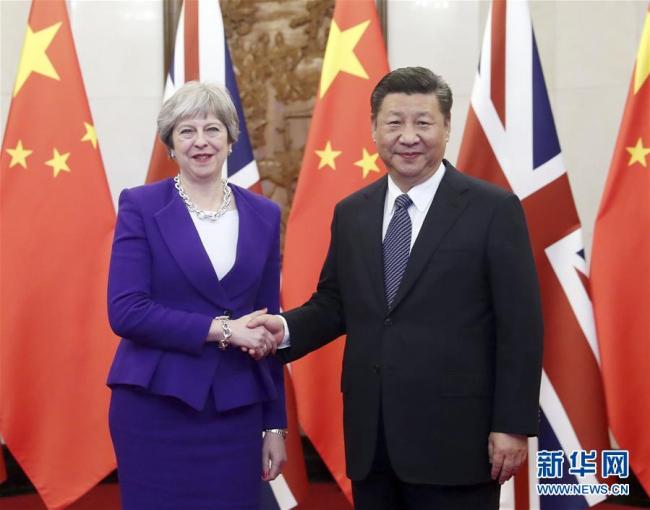 Chinese President Xi Jinping (right) meets with visiting British Prime Minister Theresa May at the Diaoyutai State Guesthouse in Beijing on February 1, 2018. [Photo: Xinhua]