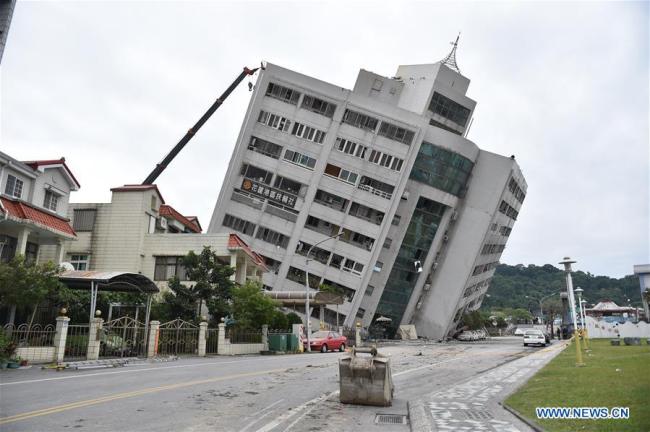 A building is tilted in quake-hit Hualien County, southeast China's Taiwan, Feb. 7, 2018. [Photo: Xinhua]