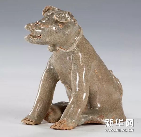 An exhibition of cultural relics is held at the National Museum of China in Beijing to celebrate the Year of the Dog. [Photo: Xinhua]