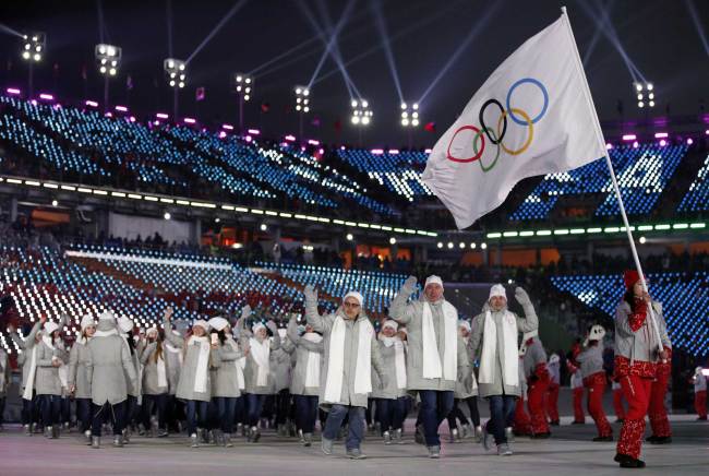 Athletes from Russia wave during the opening ceremony of the 2018 Winter Olympics in Pyeongchang, South Korea, Friday, Feb. 9, 2018. [File Photo: AP/Jae C. Hong]