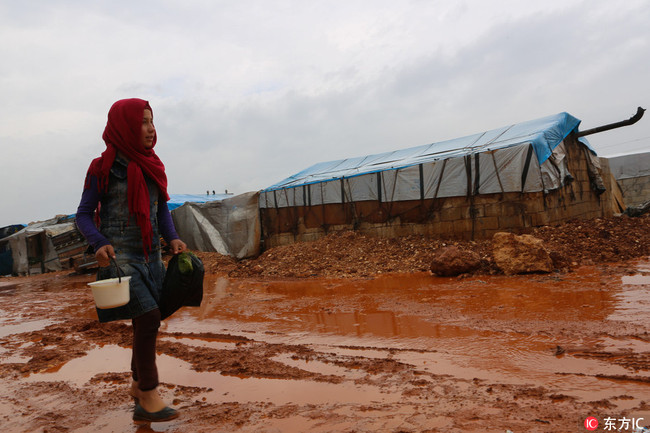 Internally displaced Syrians face a difficult humanitarian situation in Syria’s Atma camp. Recent rainfalls have made the camp very muddy. According to the UN, the Syrian conflict has created 6.5 million people, including 2.8 million children, displaced within Syria, making the internally displaced population in Syria the biggest internally displaced population in the World. [Photo: IC]