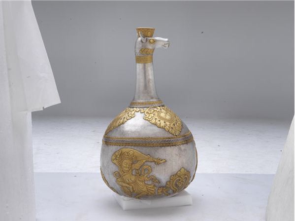 A silver kettle from Jokhang Monastery is among more than 200 precious relics on display. [Photo provided to China Daily]