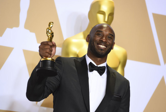 Kobe Bryant, winner of the award for best animated short for "Dear Basketball", poses in the press room at the Oscars on Sunday, March 4, 2018, at the Dolby Theatre in Los Angeles. [Photo by Jordan Strauss/Invision/AP]