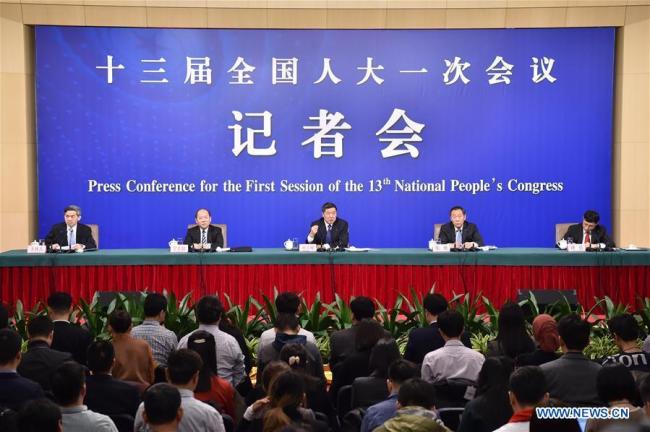 Head of the National Development and Reform Commission (NDRC) He Lifeng (C), deputy heads of the NDRC Zhang Yong (R) and Ning Jizhe, take questions during a press conference on innovation and improvement of macro-economic control and promotion of high quality development for the first session of the 13th National People's Congress in Beijing, capital of China, March 6, 2018.[Photo:Xinhua]