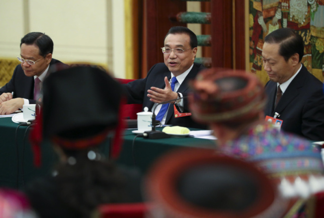 Chinese Premier Li Keqiang joins a panel discussion with the deputies from southern Guangxi Zhuang Autonomous Region at the first session of the 13th National People's Congress in Beijing, capital of China, March 6, 2018. [Photo: gov.cn]