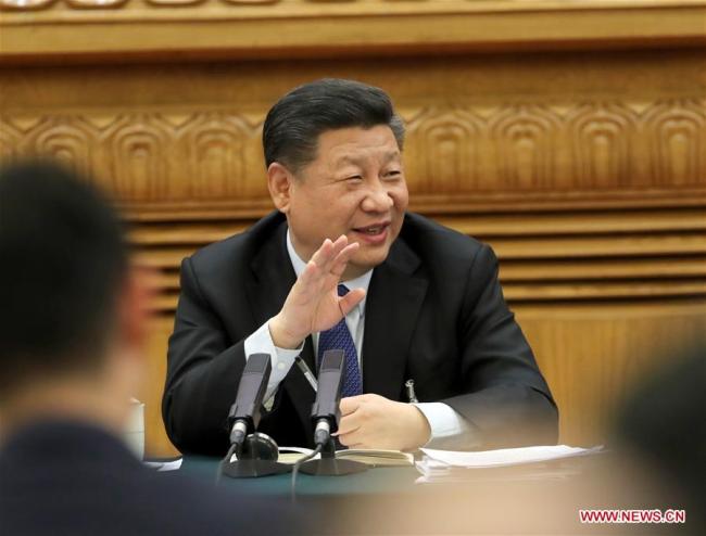 Chinese President Xi Jinping, also general secretary of the Communist Party of China (CPC) Central Committee and chairman of the Central Military Commission, joins a panel discussion with the deputies from Guangdong Province at the first session of the 13th National People's Congress in Beijing, capital of China, March 7, 2018. [Photo:Xinhua/Liu Weibing]