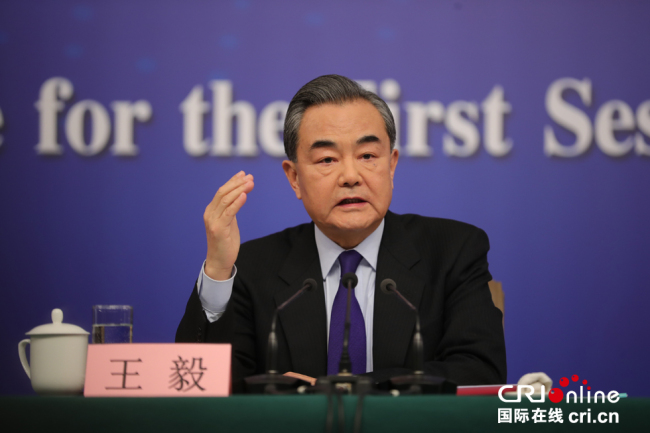 Chinese Foreign Minister Wang Yi answers questions from journalists at a news conference in Beijing, on the sidelines of the national legislature's annual session on March 8, 2018. [Photo: CRI Online/Shen Shi]