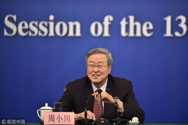 Zhou Xiaochuan, head of the People's Bank of China, speaks at a press conference on the sidelines of the first session of the 13th National People's Congress on March 9, 2018. [Photo: VCG]
