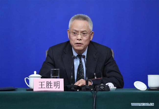 Wang Shengming, vice chairman of Internal and Judicial Affairs Committee of the 12th National People's Congress (NPC), answers questions at a press conference on legislation work of the NPC on the sidelines of the first session of the 13th NPC in Beijing, March 12, 2018.[Photo: Xinhua]