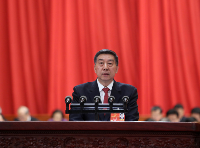 Chinese State Councilor Wang Yong delivers an institutional restructuring plan of the State Council at the fourth plenary meeting of the first session of the 13th National People's Congress (NPC) at the Great Hall of the People in Beijing, March 13, 2018.[Photo: Xinhua]