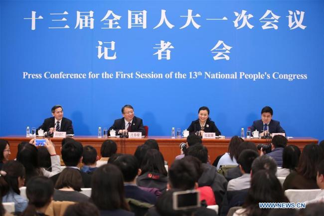 Shen Chunyao (2nd L), secretary of the Bill Group of Secretariat of the first session of the 13th National People's Congress (NPC) and chairman of the Legislative Affairs Commission of the NPC Standing Committee, and Zheng Shuna (2nd R), deputy secretary of the Bill Group of Secretariat of the first session of the 13th NPC and vice chairperson of the Legislative Affairs Commission of the NPC Standing Committee, take questions at a press conference on an amendment to the country's Constitution in Beijing, capital of China, March 11, 2018. [Photo:Xinhua]