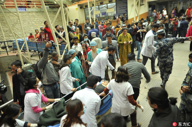Nepalese doctors pull the stretcher of a survivor of US-Bangla plane crash for further treatment at Kathmandu Medical College Hospital at Kathmandu, Nepal on Monday, March 12, 2018. [Photo: IC]