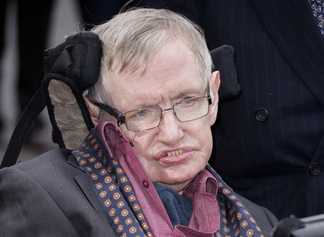 In this March 30, 2015 file photo, Professor Stephen Hawking arrives for the Interstellar Live show at the Royal Albert Hall in central London. Hawking, whose brilliant mind ranged across time and space though his body was paralyzed by disease, has died, a family spokesman said early Wednesday, March 14, 2018. [File photo: AP]